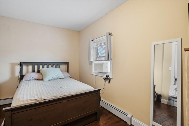 bedroom featuring baseboard heating and dark wood-type flooring