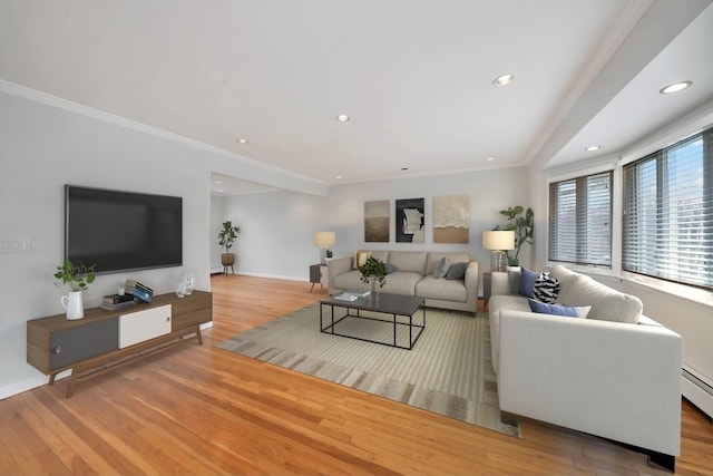 living room featuring crown molding and hardwood / wood-style flooring