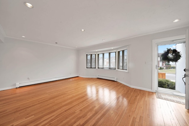 unfurnished room with a baseboard radiator, crown molding, and light wood-type flooring