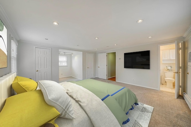 carpeted bedroom featuring crown molding and ensuite bath