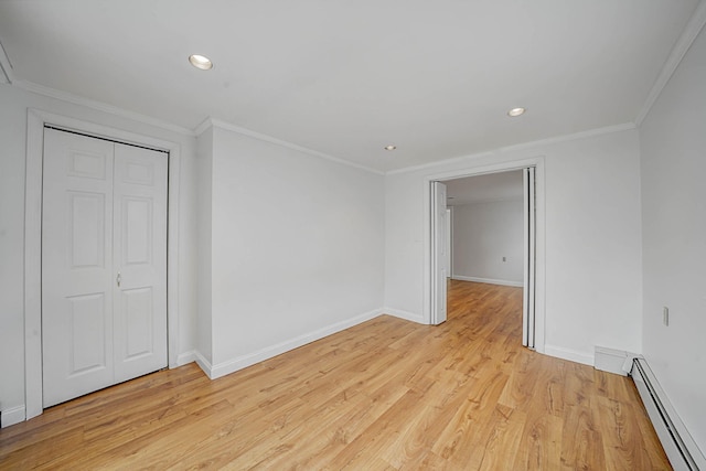 unfurnished bedroom featuring light wood-type flooring, a closet, ornamental molding, and a baseboard radiator