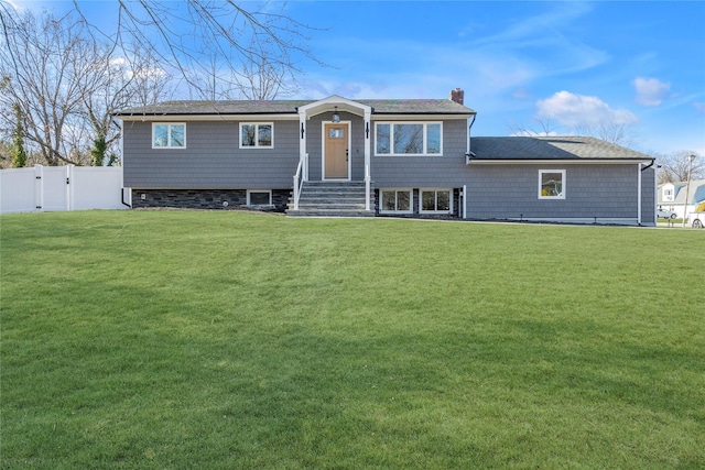 view of front of home with a front lawn