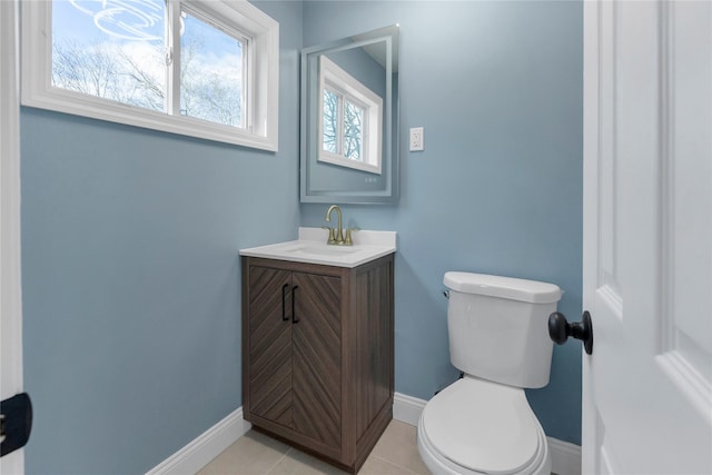 bathroom with tile patterned floors, vanity, and toilet