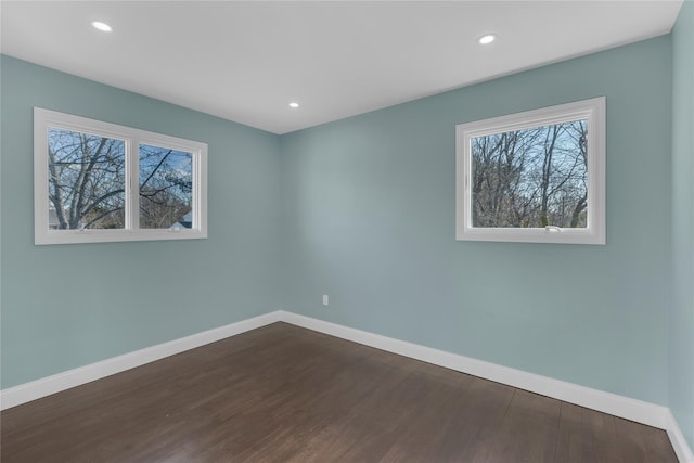 empty room featuring dark hardwood / wood-style floors