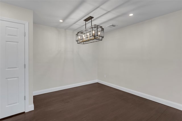 unfurnished dining area with dark hardwood / wood-style flooring