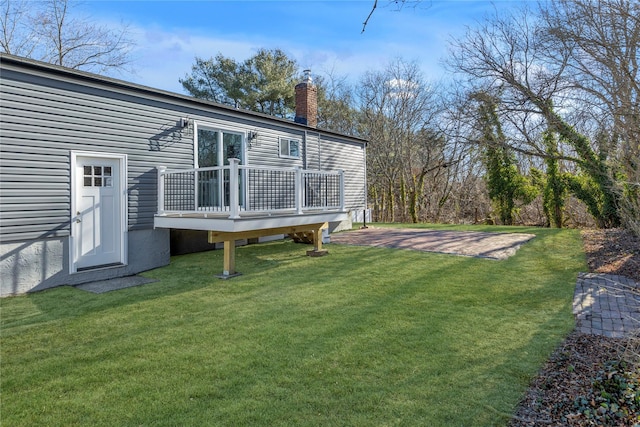 view of yard featuring a wooden deck