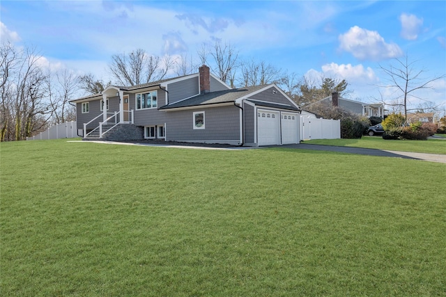 view of home's exterior featuring a garage and a yard