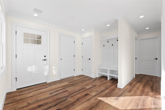 entrance foyer featuring crown molding and dark wood-type flooring