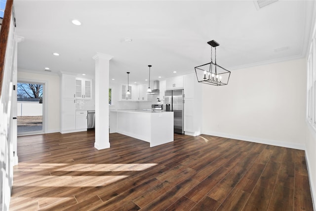 unfurnished living room with crown molding and dark hardwood / wood-style flooring