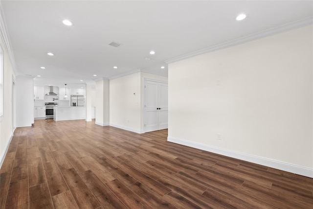 unfurnished living room with ornamental molding and dark hardwood / wood-style floors