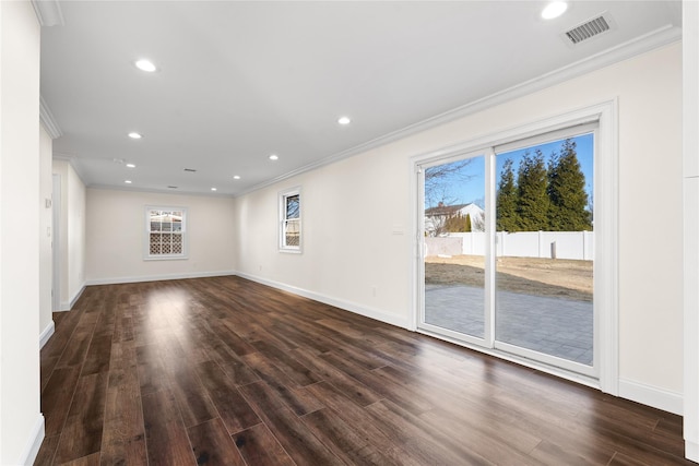 unfurnished room featuring crown molding, plenty of natural light, and dark hardwood / wood-style floors