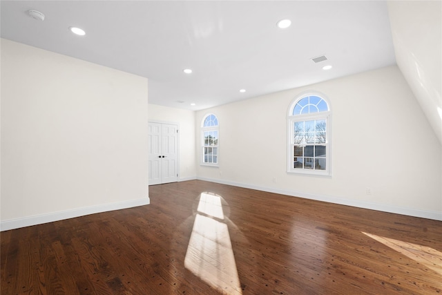 empty room with dark wood-type flooring