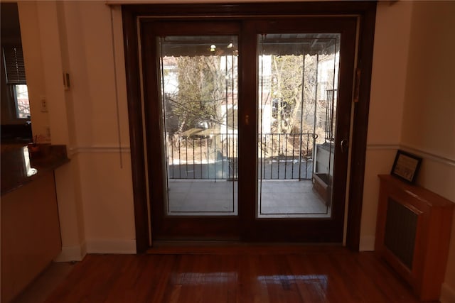 doorway to outside with hardwood / wood-style floors