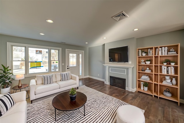 living room featuring dark hardwood / wood-style flooring