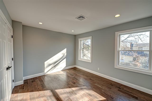 empty room featuring hardwood / wood-style floors