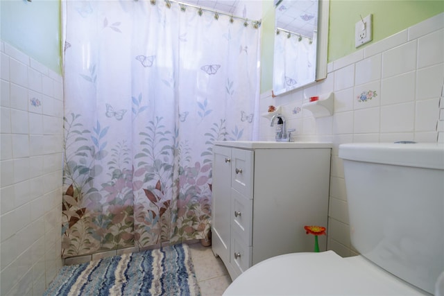 bathroom with vanity, toilet, tile walls, and a shower with curtain