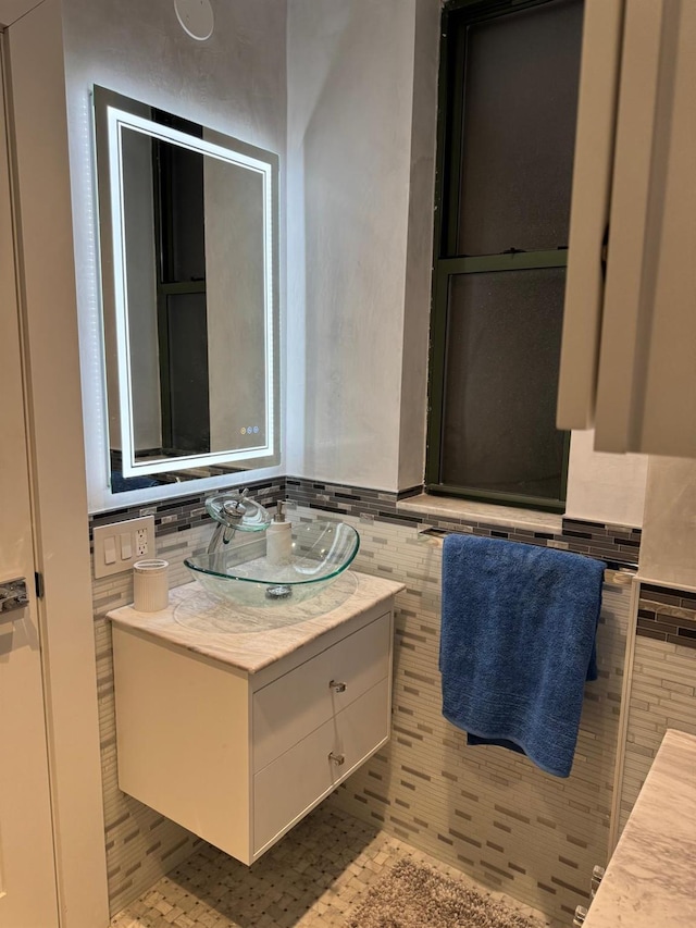 bathroom featuring tile patterned flooring and vanity