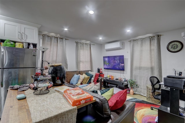 living room featuring hardwood / wood-style flooring and a wall mounted AC