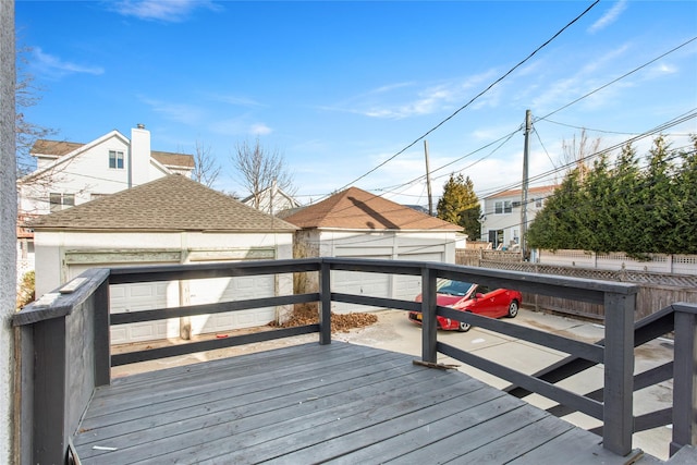 deck featuring fence and an outdoor structure