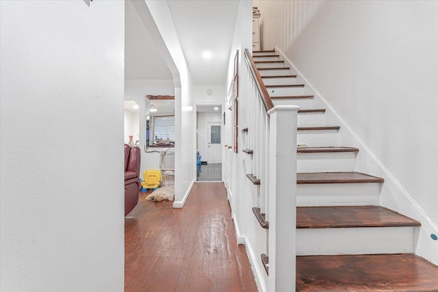 staircase featuring hardwood / wood-style floors