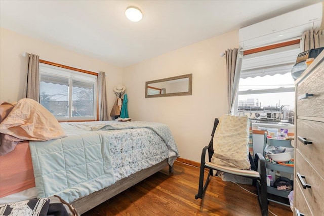 bedroom with dark hardwood / wood-style flooring