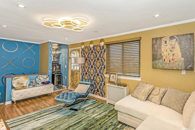 living room with ornamental molding and hardwood / wood-style floors