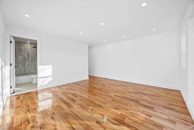 spare room featuring light hardwood / wood-style flooring