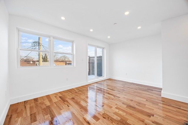 unfurnished room with light hardwood / wood-style floors