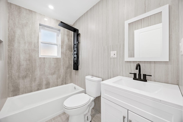 full bathroom featuring toilet, bathing tub / shower combination, and vanity