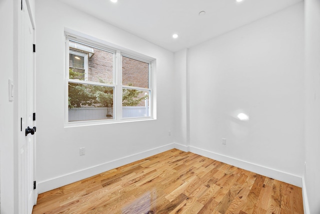 spare room with light hardwood / wood-style floors