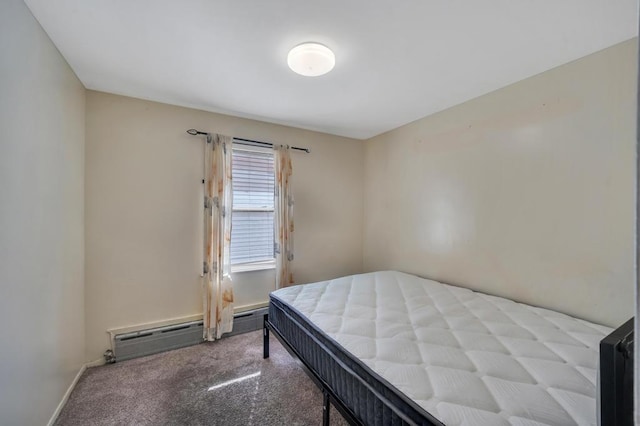 bedroom featuring light carpet, a baseboard radiator, and baseboards