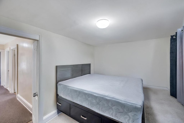 carpeted bedroom with baseboards