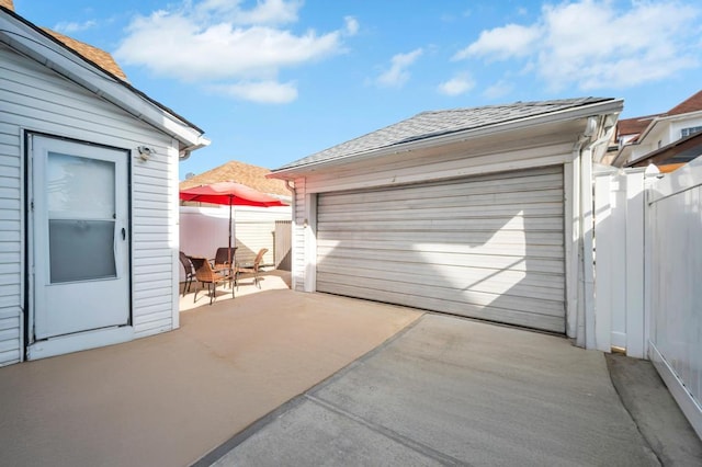 detached garage with fence