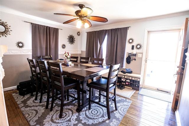 dining area featuring plenty of natural light, ceiling fan, wood-type flooring, and ornamental molding