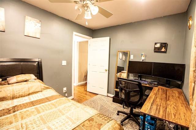 bedroom with ceiling fan and light wood-type flooring