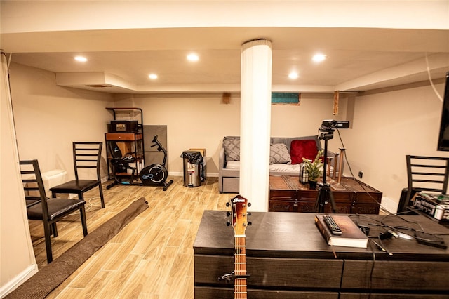 workout area featuring light hardwood / wood-style floors