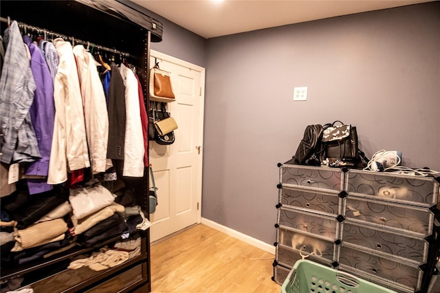 spacious closet featuring hardwood / wood-style flooring