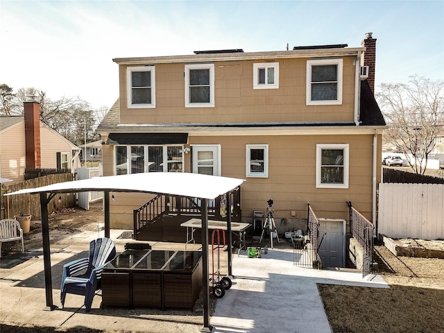 rear view of property with a patio