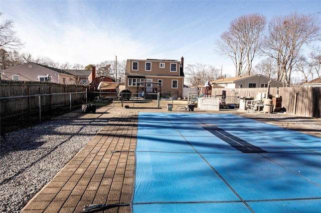 view of swimming pool featuring a wooden deck