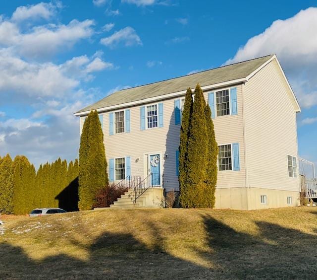 exterior space featuring a front lawn