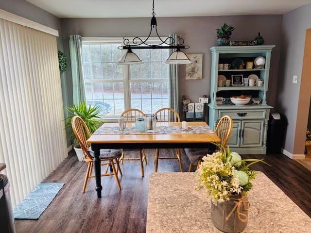 dining space featuring dark hardwood / wood-style floors