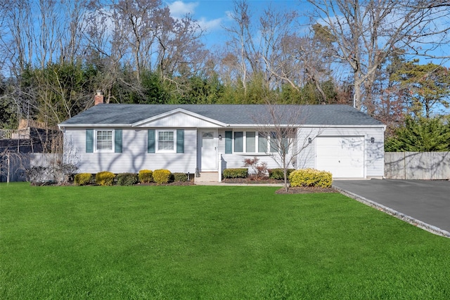 single story home with a front yard and a garage