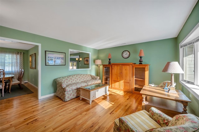 sitting room with light hardwood / wood-style flooring