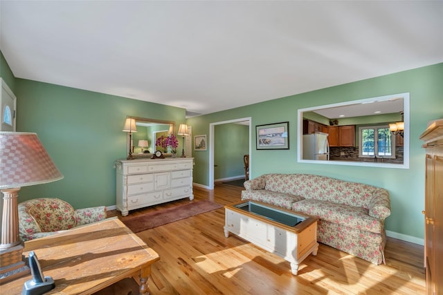 living room with light hardwood / wood-style flooring