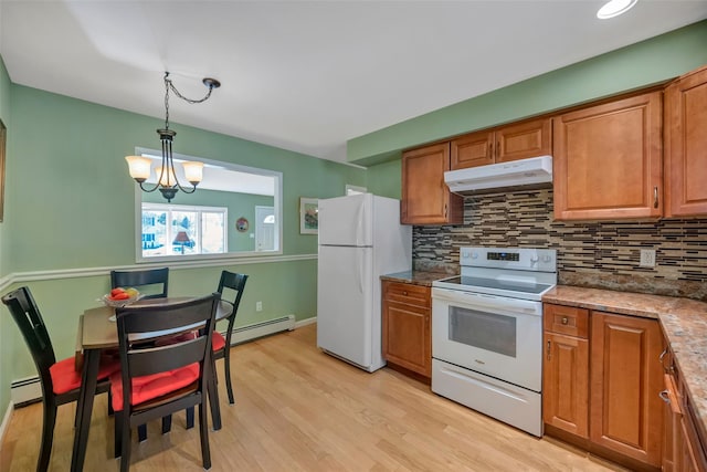 kitchen with a notable chandelier, white appliances, hanging light fixtures, and baseboard heating