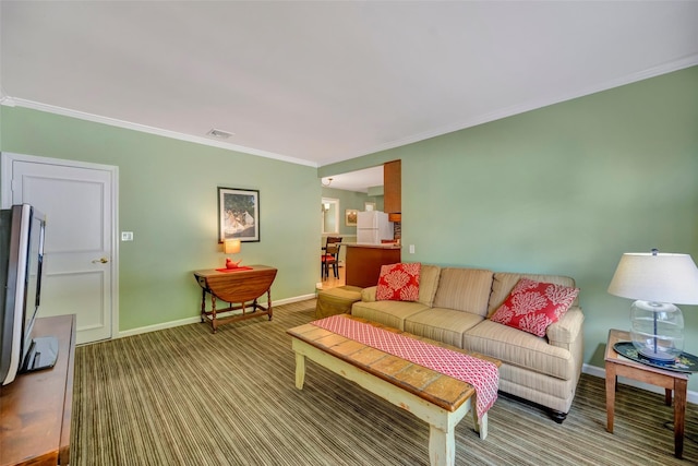 carpeted living room featuring ornamental molding