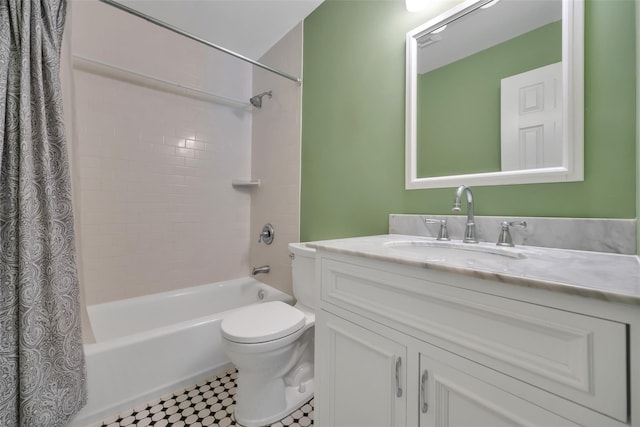 full bathroom featuring vanity, shower / bath combo, and toilet