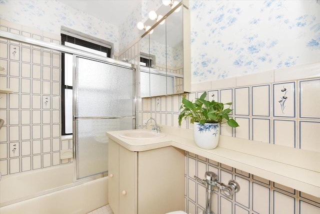 bathroom with vanity and enclosed tub / shower combo