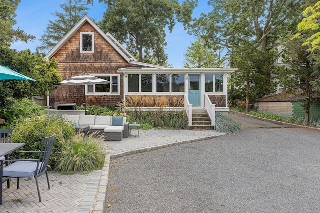 back of house featuring an outdoor hangout area and a patio