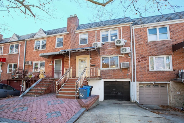 multi unit property featuring a garage